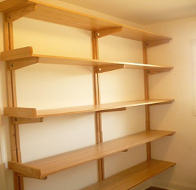 The Wooden You solid oak rail, arm and Airshelf system mounted on a wall